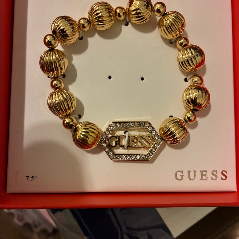 GUESS Gold-Tone Bracelet with Crystal Logo - Picture 2 of 4